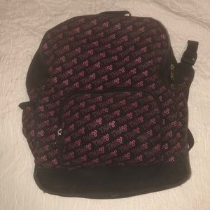 Pink and black TNA backpack